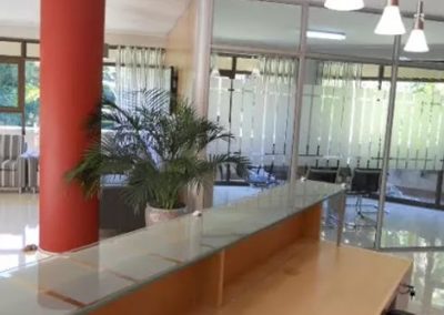Back of reception desk with meeting rooms