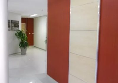 Detailed partition – maple wood with Aluminium trim and wallpaper to passage
